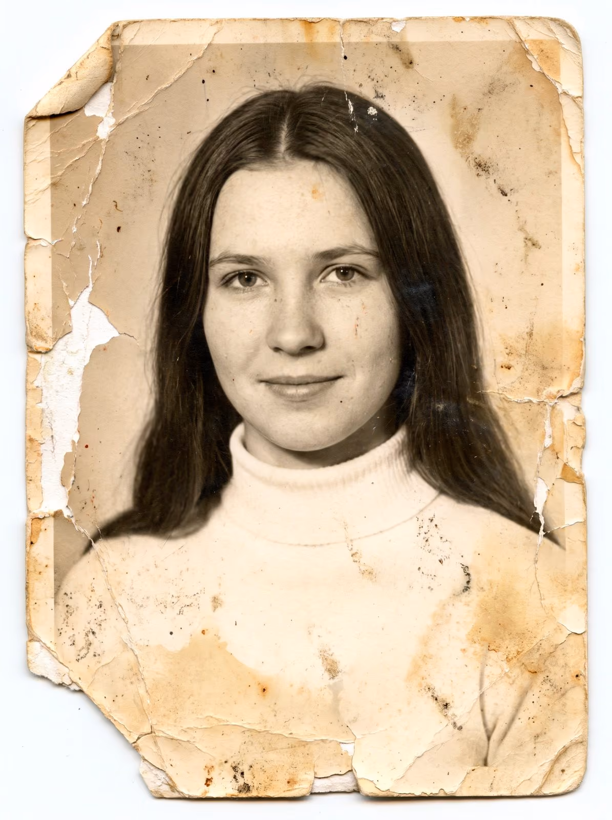 A torn and stained portrait print before scanning and restoration