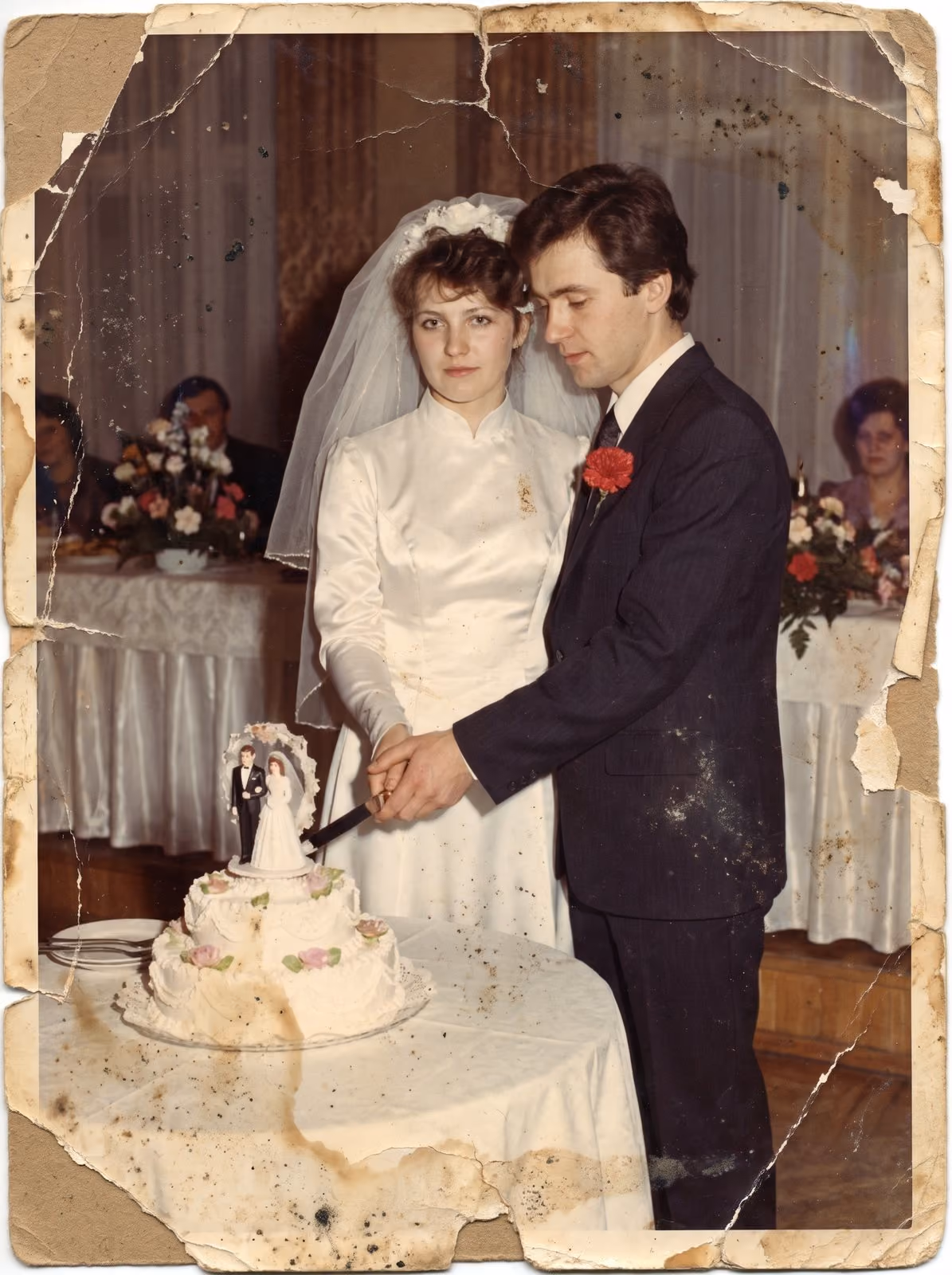 A stained wedding print, the kind of original that can be posted for restoration